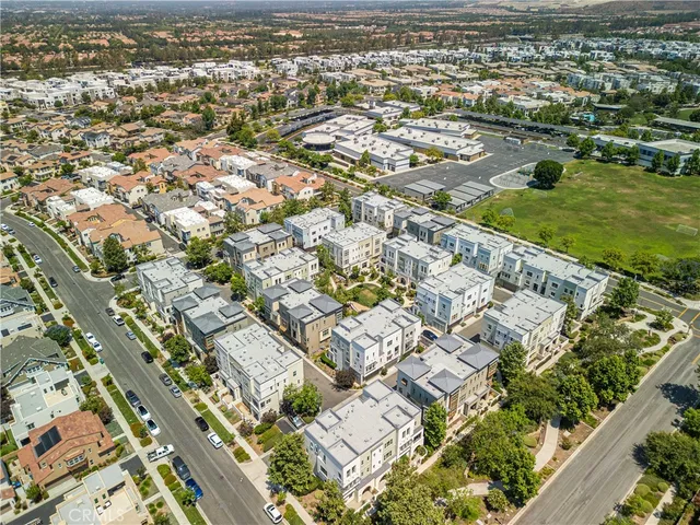 an aerial view of residential building and ocean