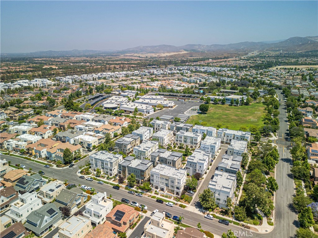 134 Acamar Irvine, CA 92618 - Photo 44 of 56 an aerial view of residential building and lake