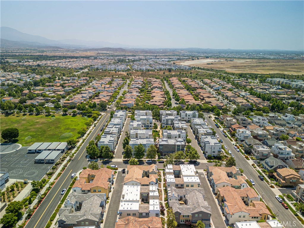 134 Acamar Irvine, CA 92618 - Photo 47 of 56 an aerial view of residential building and lake