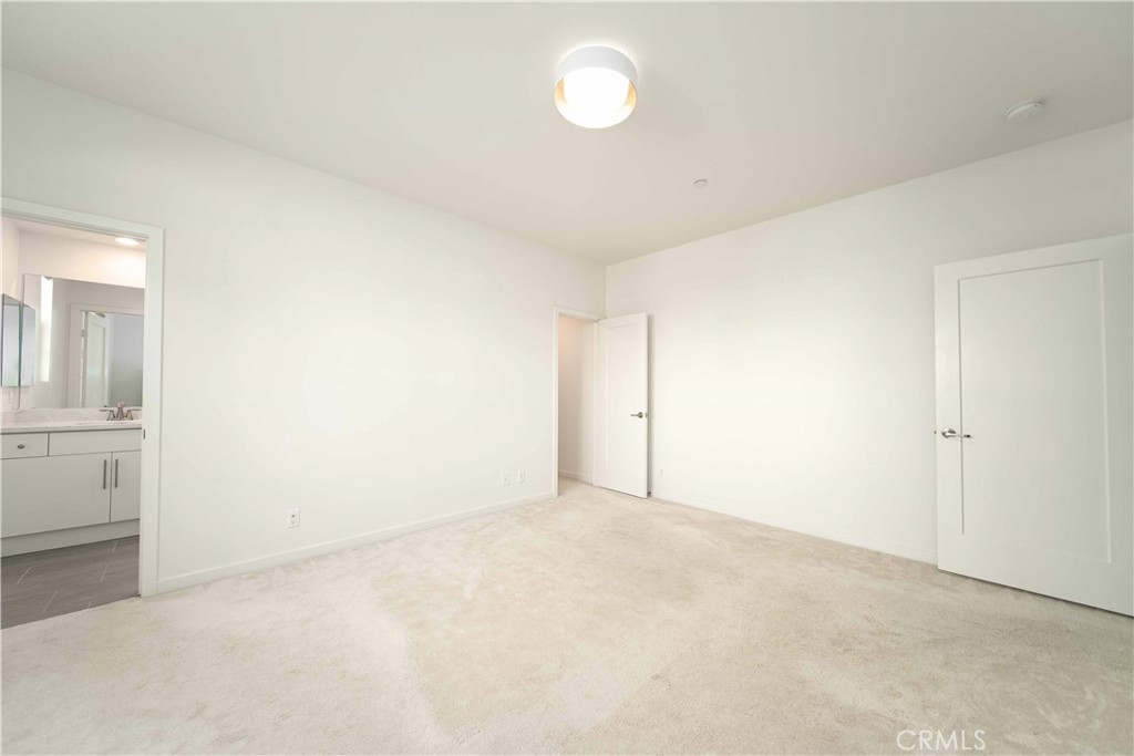 134 Acamar Irvine, CA 92618 - Photo 6 of 56 an empty room with cabinet and mirrors