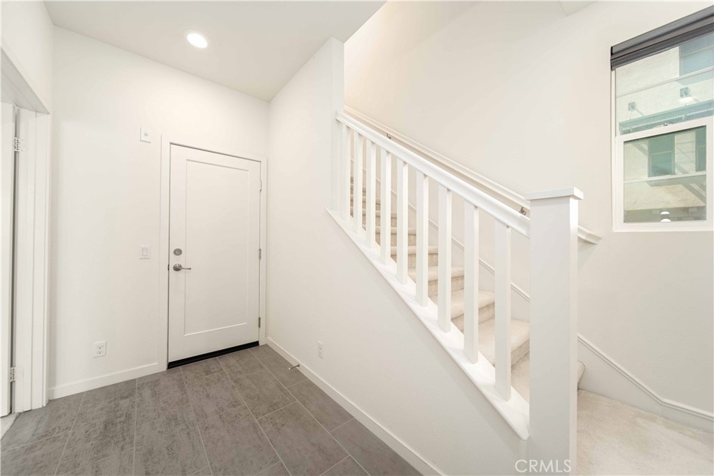 134 Acamar Irvine, CA 92618 - Photo 9 of 56 a view of staircase with white walls and a window