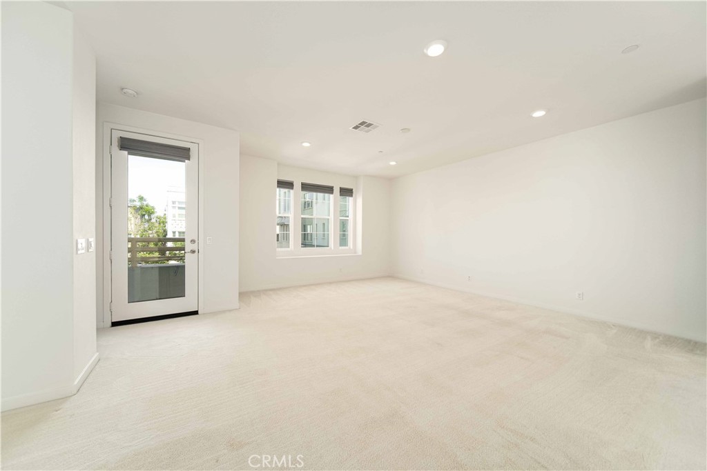 134 Acamar Irvine, CA 92618 - Photo 10 of 56 an empty room with windows and entrance
