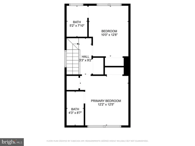 a picture of a bench in front of a wall