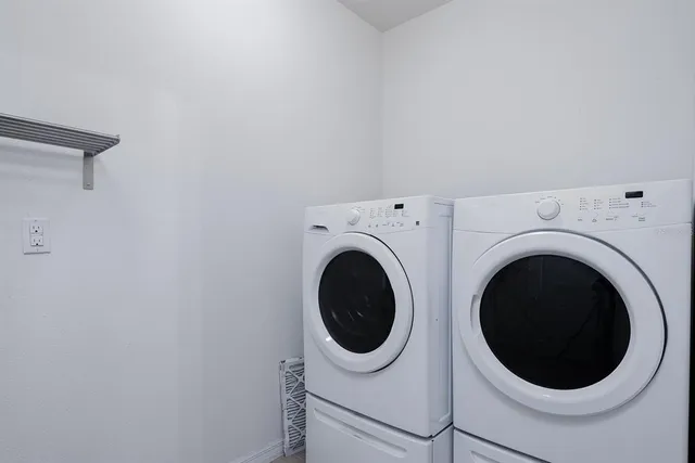 a utility room with dryer and washer