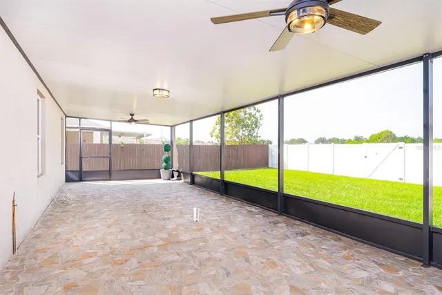 a view of an empty room with glass windows