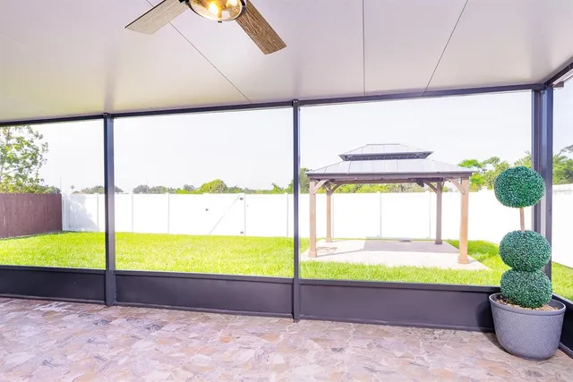 a bathroom with a tub and window