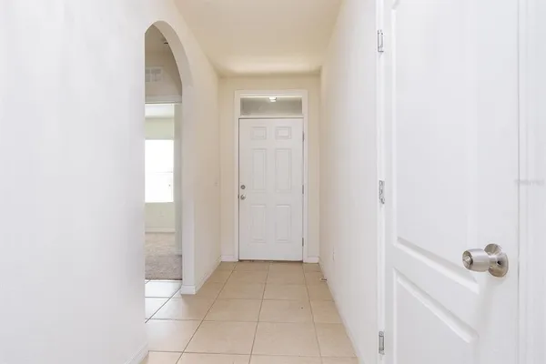 a view of a room with white walls