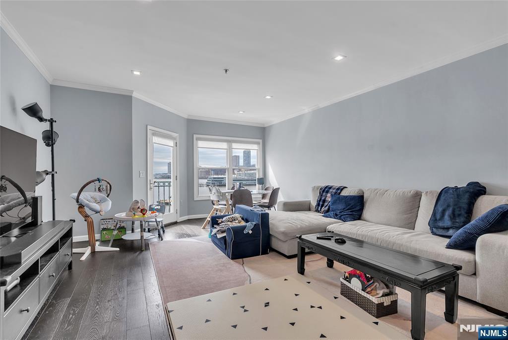 314 The Promenade Edgewater, NJ 07020 - Photo 10 of 37 a living room with furniture a couch and a flat screen tv