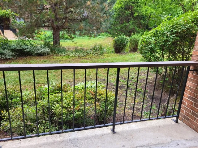 a porch with a yard in back