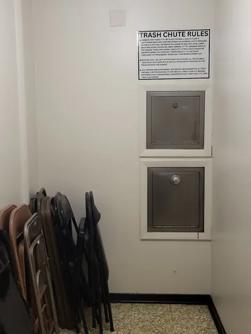 a view of parking garage with cars and other equipment