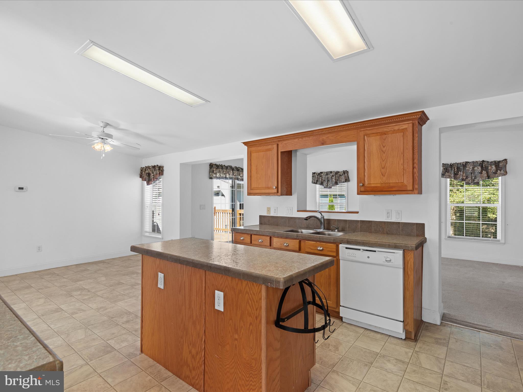 37531 Bonnie Street Ocean View, DE 19970 - Photo 16 of 62 a kitchen with stainless steel appliances a sink stove and cabinets