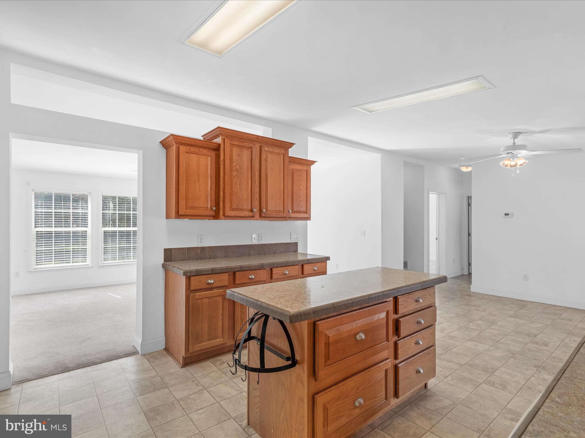 37531 Bonnie Street Ocean View, DE 19970 - Photo 17 of 62 a kitchen with stainless steel appliances granite countertop a stove a sink and a refrigerator