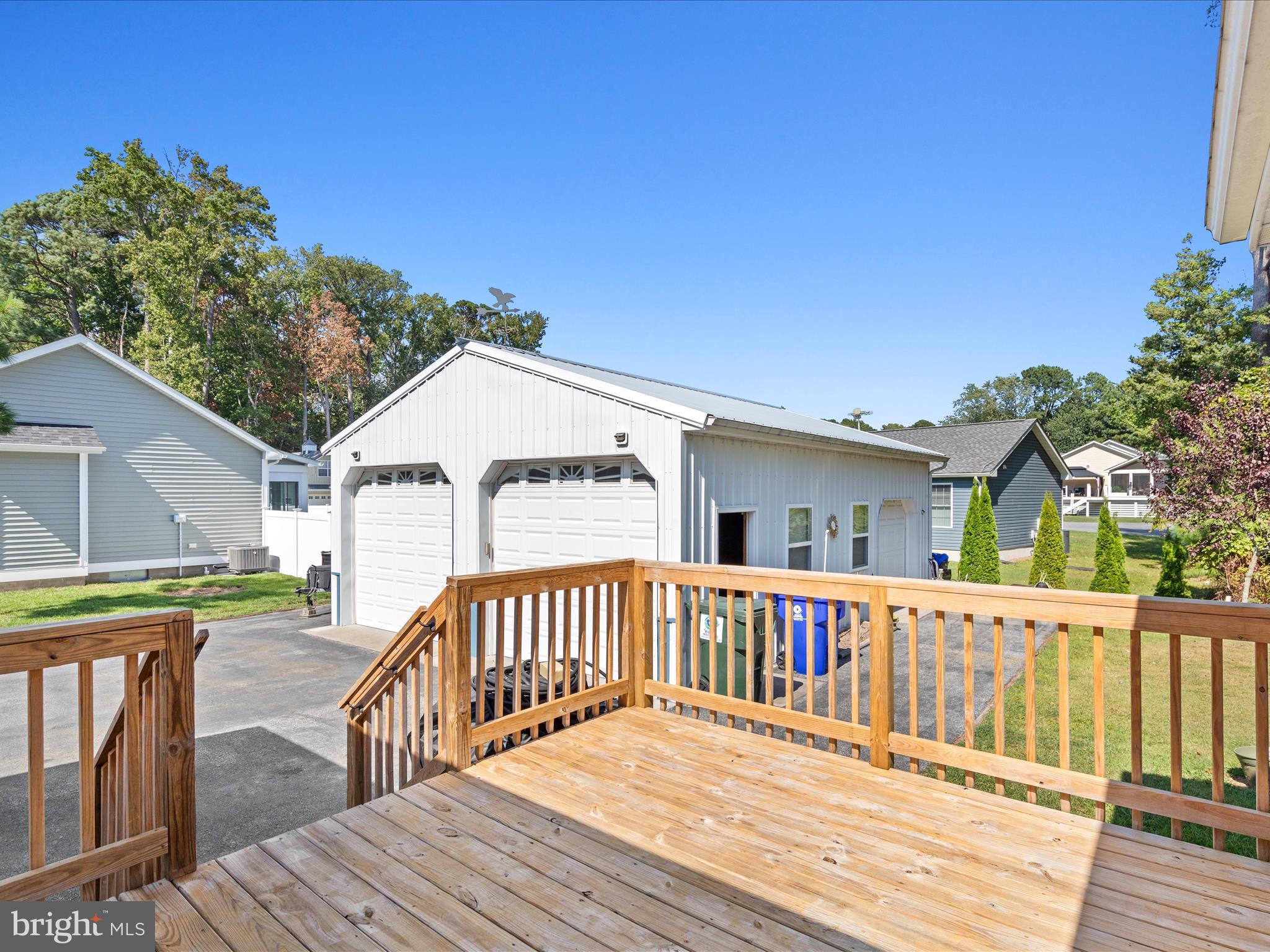 37531 Bonnie Street Ocean View, DE 19970 - Photo 38 of 62 a view of a wooden deck and a yard