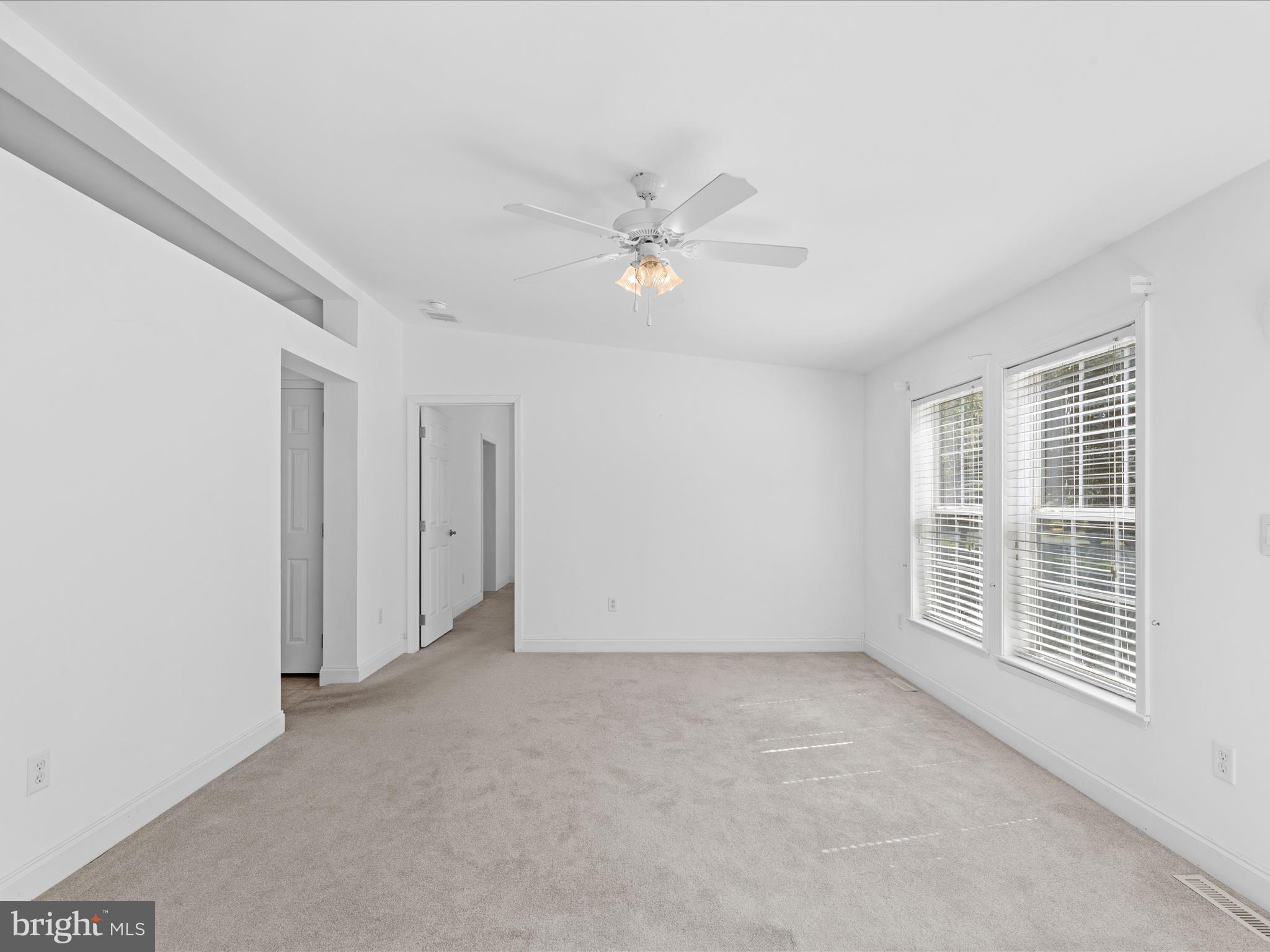 37531 Bonnie Street Ocean View, DE 19970 - Photo 5 of 62 wooden floor in an empty room with a window