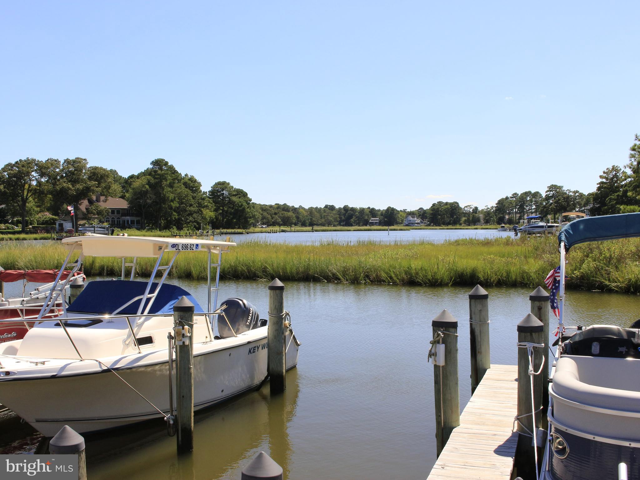 37531 Bonnie Street Ocean View, DE 19970 - Photo 52 of 62 a view of a lake with couches in patio