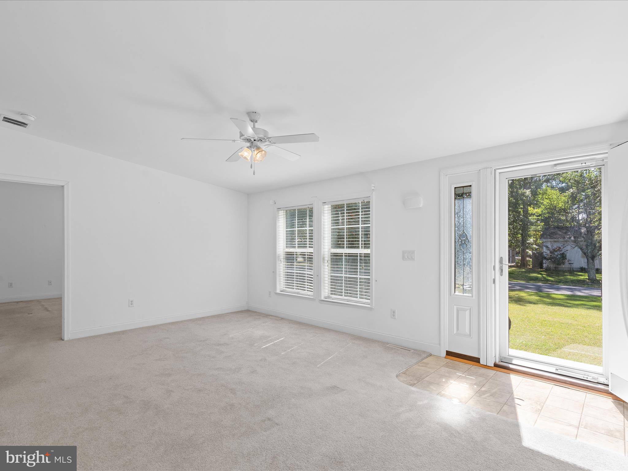 37531 Bonnie Street Ocean View, DE 19970 - Photo 7 of 62 wooden floor in an empty room with a window