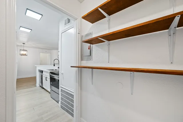 a kitchen with a sink and refrigerator