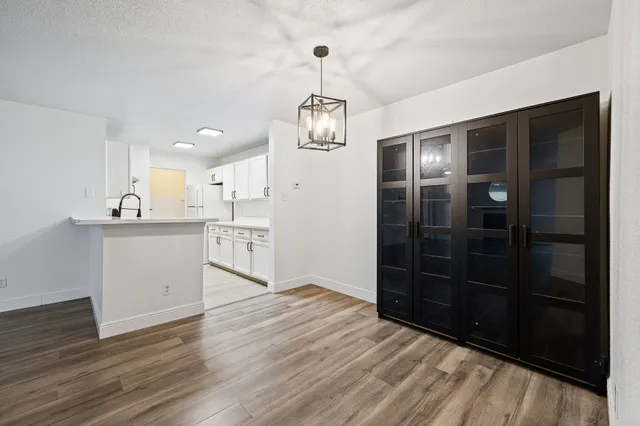 a view of a kitchen with a sink and dishwasher