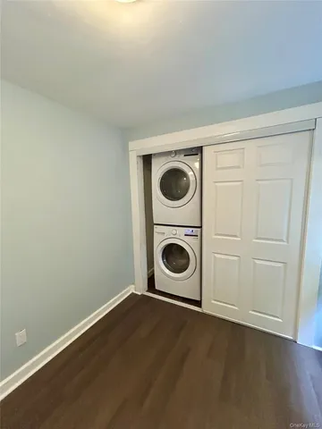 an entryway with a washer and dryer