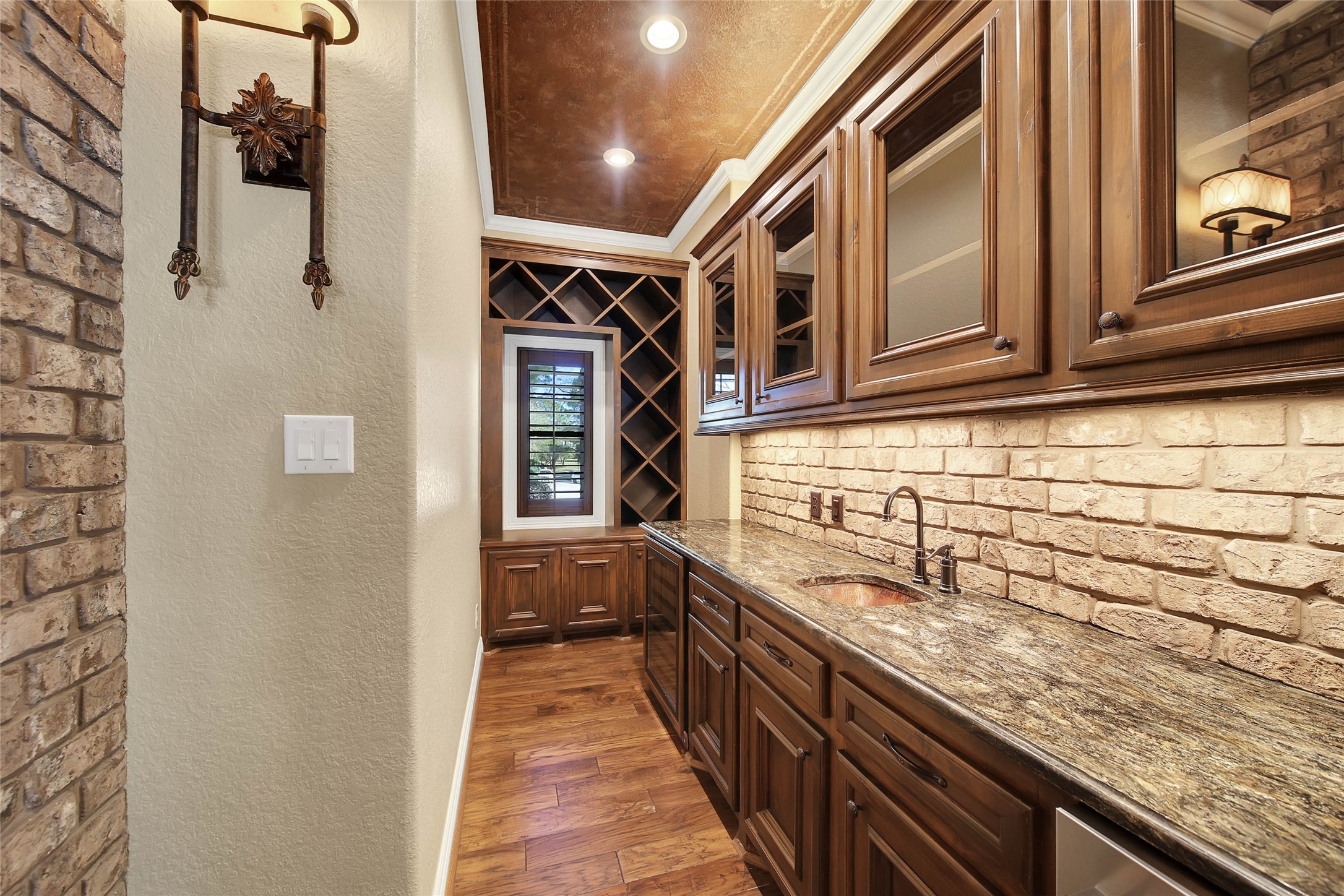 6803 Star Ledge Court Spring, TX 77389 - Photo 6 of 48 A closer view of the wet bar with window offering a view of the front grounds