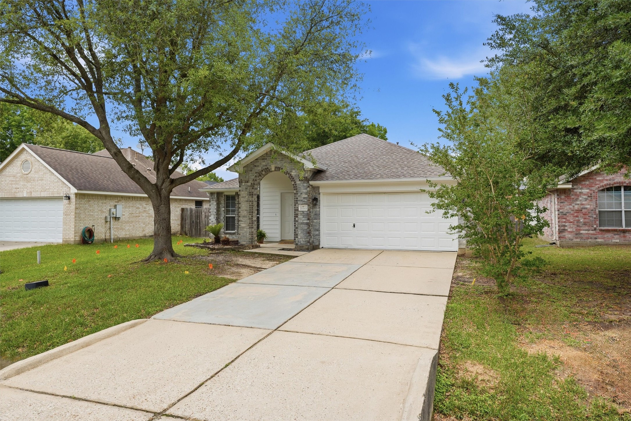 21543 Forest Colony Drive Porter, TX 77365 - Photo 26 of 32 another view of the front with nice shade tree, all real close to schools, freeway access, and GOOD shopping & community park/ Pool is walking distance. Real close to Valley Ranch.