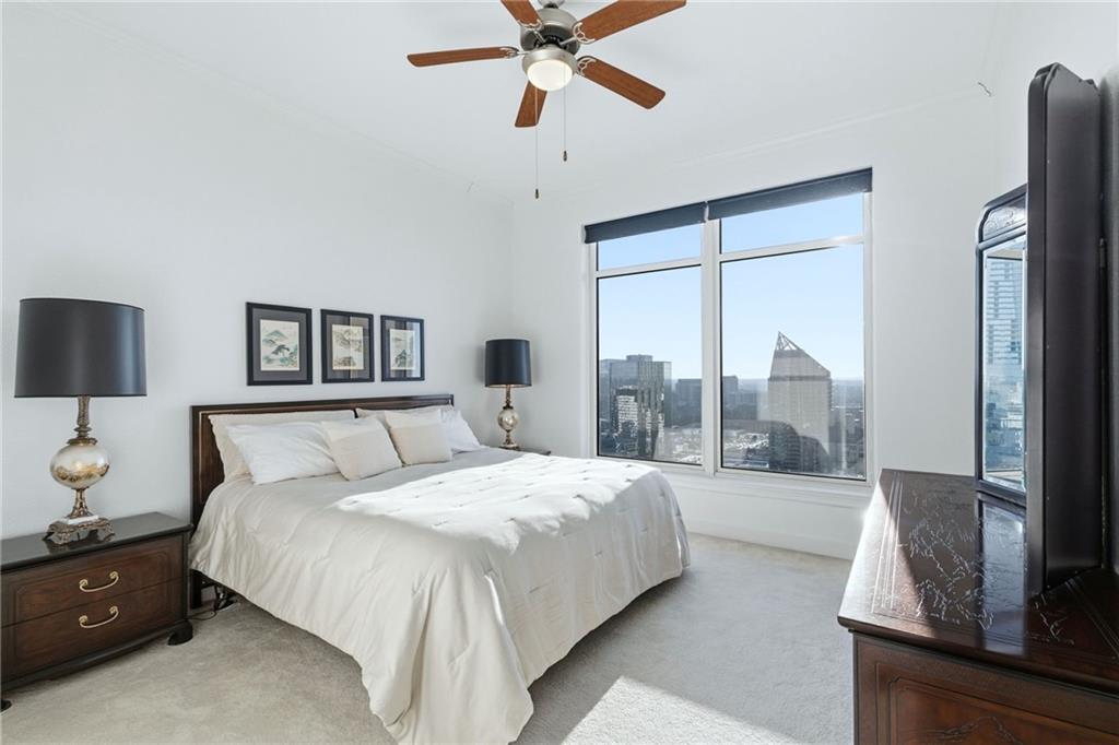 3445 Stratford Road Northeast, Unit 3601 Atlanta, GA 30326 - Photo 11 of 37 a spacious bedroom with a bed and window
