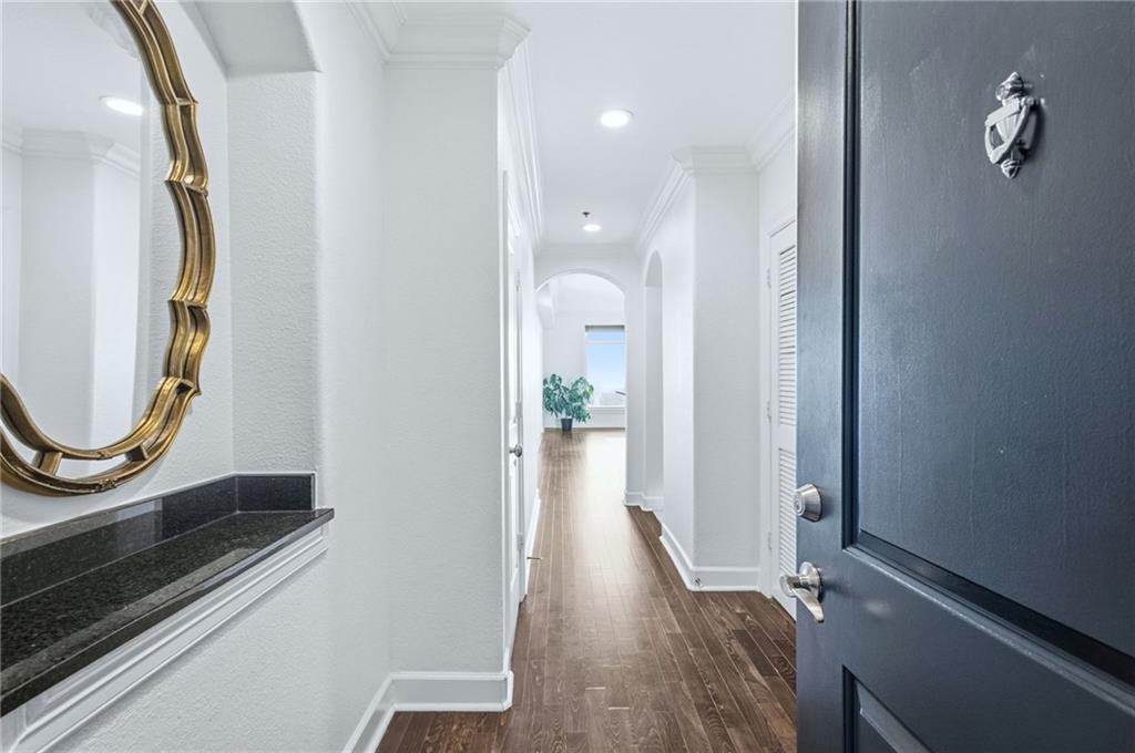 3445 Stratford Road Northeast, Unit 3601 Atlanta, GA 30326 - Photo 2 of 37 a view of a hallway with wooden floor and staircase