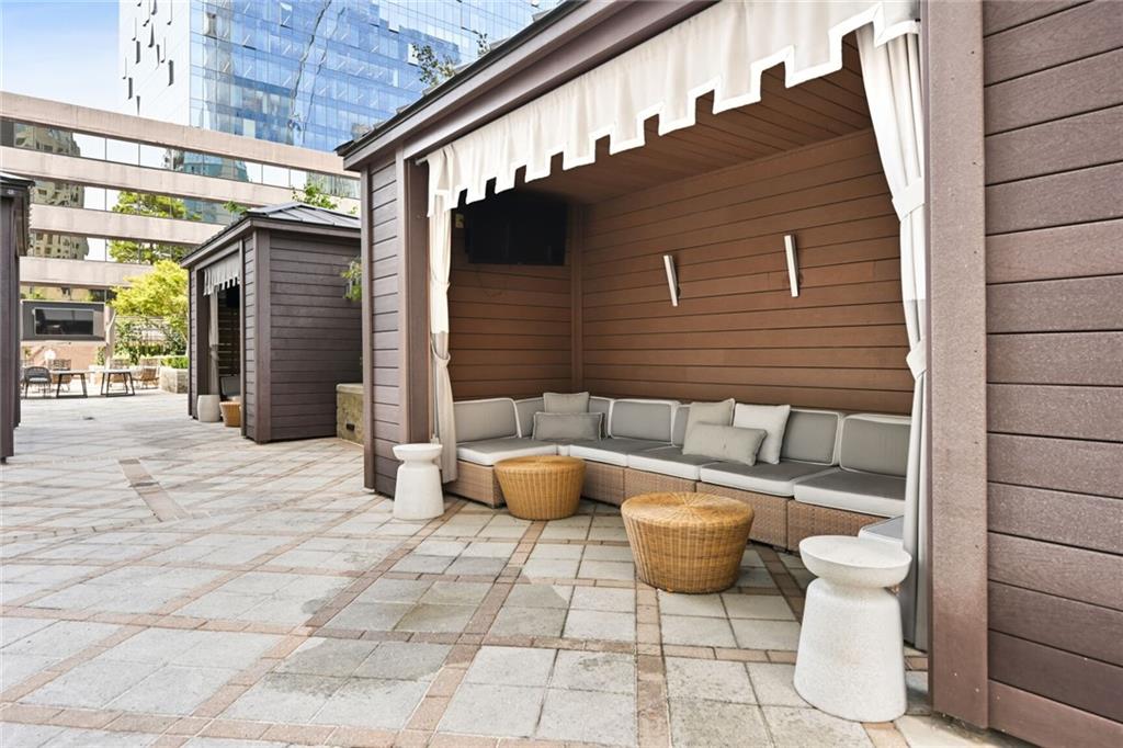 3445 Stratford Road Northeast, Unit 3601 Atlanta, GA 30326 - Photo 28 of 37 a view of a patio with couple of chairs and a potted plant