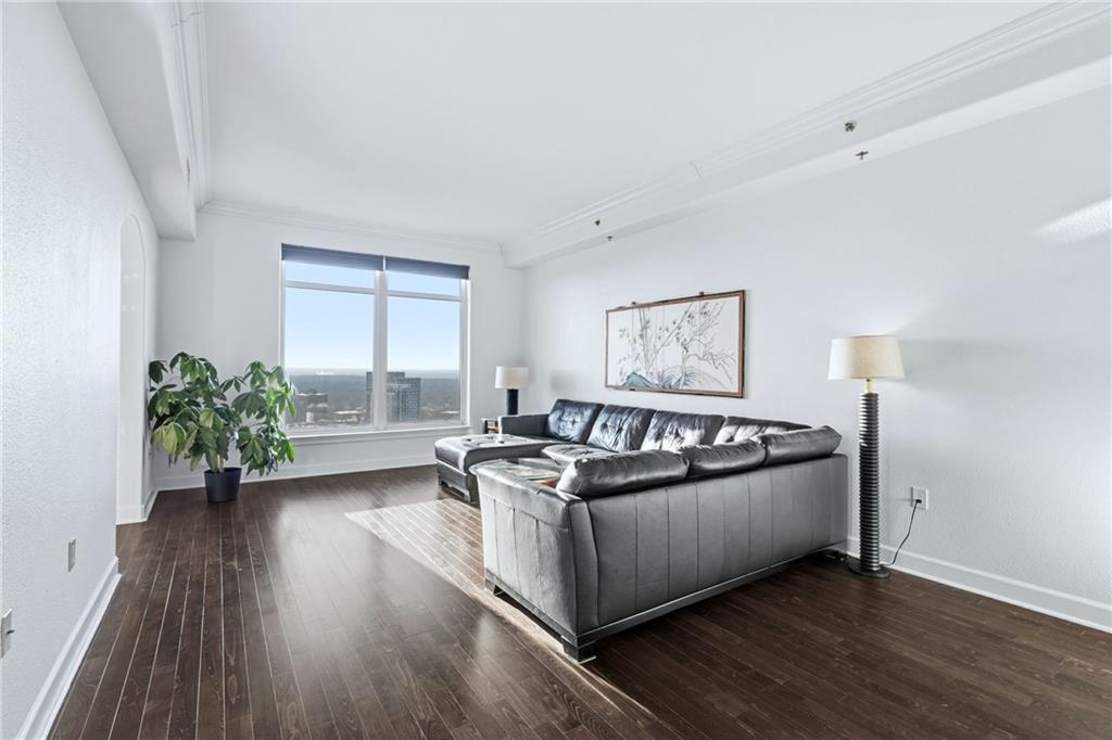 3445 Stratford Road Northeast, Unit 3601 Atlanta, GA 30326 - Photo 3 of 37 a living room with furniture and a large window