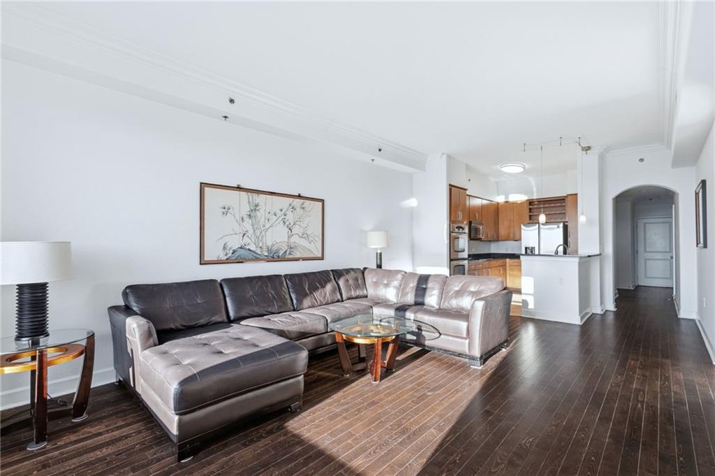 3445 Stratford Road Northeast, Unit 3601 Atlanta, GA 30326 - Photo 4 of 37 a living room with furniture and view of kitchen