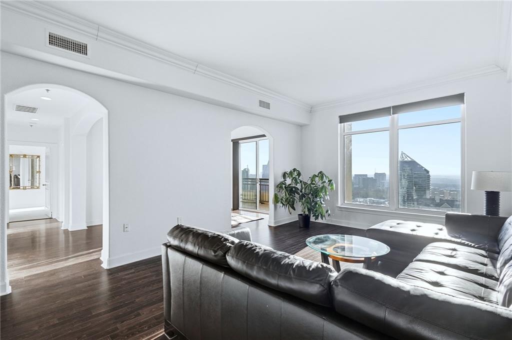 3445 Stratford Road Northeast, Unit 3601 Atlanta, GA 30326 - Photo 6 of 37 a living room with furniture and a large window