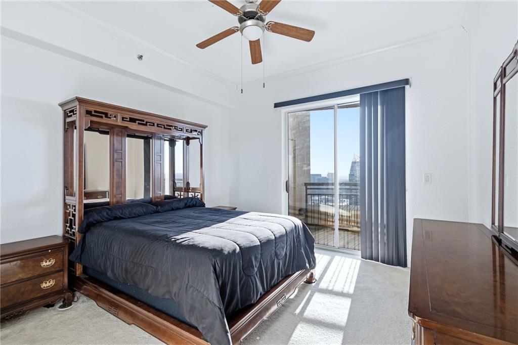 3445 Stratford Road Northeast, Unit 3601 Atlanta, GA 30326 - Photo 8 of 37 a bedroom with a large bed and a window