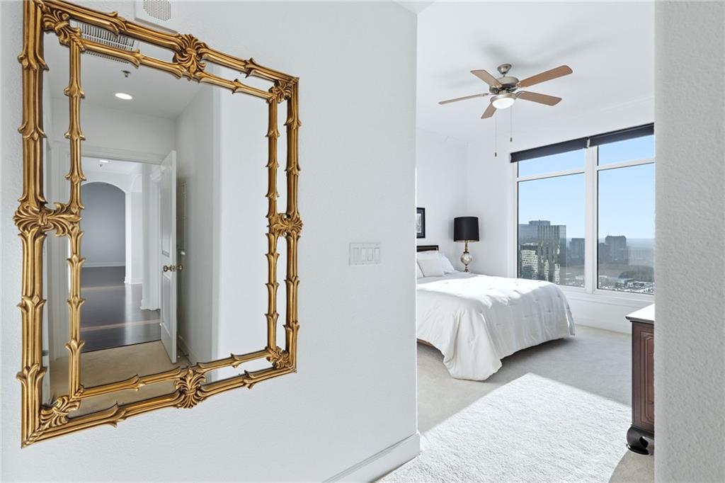 3445 Stratford Road Northeast, Unit 3601 Atlanta, GA 30326 - Photo 10 of 37 a spacious bedroom with a bed and window