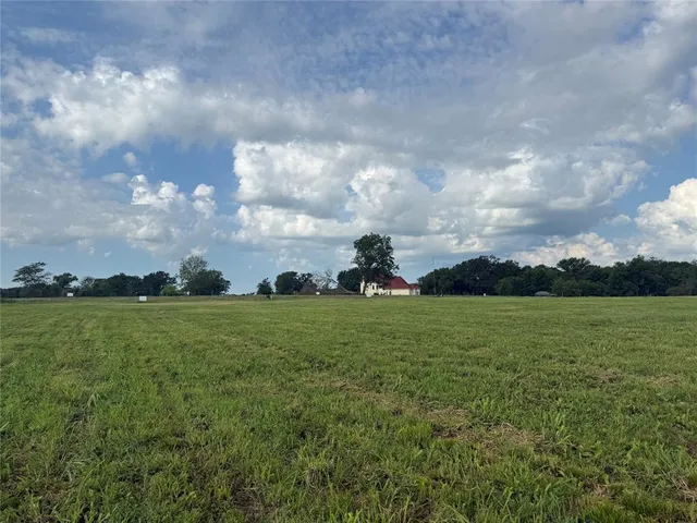 a view of a field with clear sky