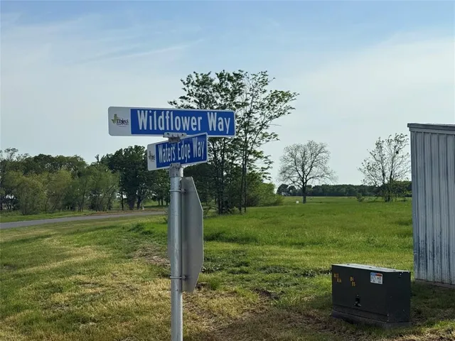 a view of a park with a sign broad