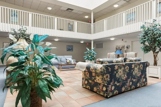 a view of a a dining room with furniture window and outside view