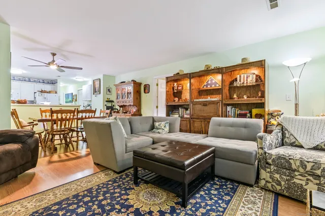 a bedroom with furniture and a window