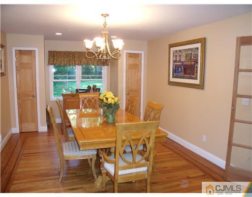 4 Regal Road Edison, NJ 08820 - Photo 6 of 10 a view of a dining room with furniture wooden floor and chandelier