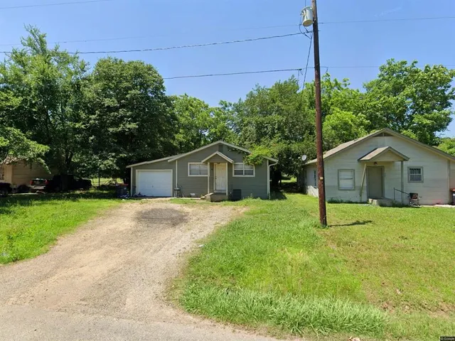 a house with trees in the background