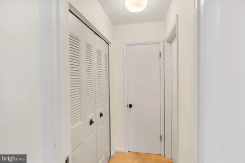 a view of a hallway with closet area