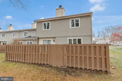 a front view of a house with a fence