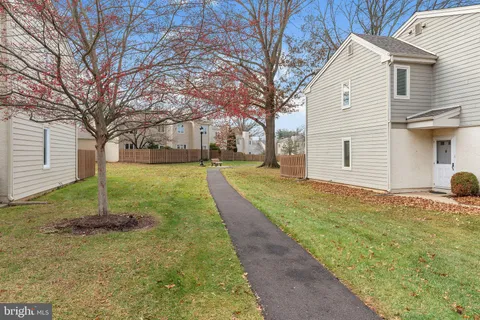 a backyard of a house with a garden and entertaining space
