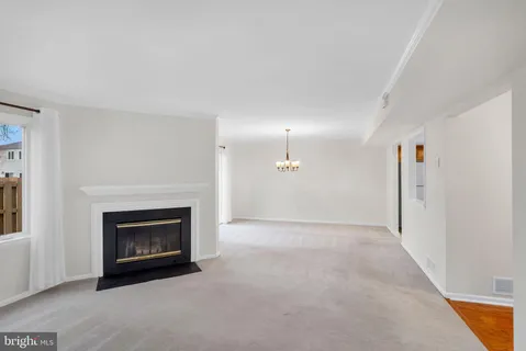 a view of empty room with a fireplace