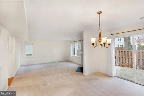 a view of empty room with windows