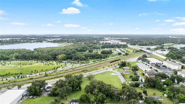 an aerial view of a city with mountains
