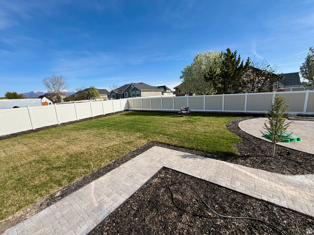 3359 Eurasian Crane Road Clinton, UT 84015 - Photo 62 of 71 Fenced backyard with a patio area