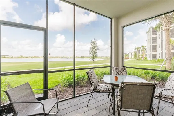 a view of a city from a dining room with large windows and outside view