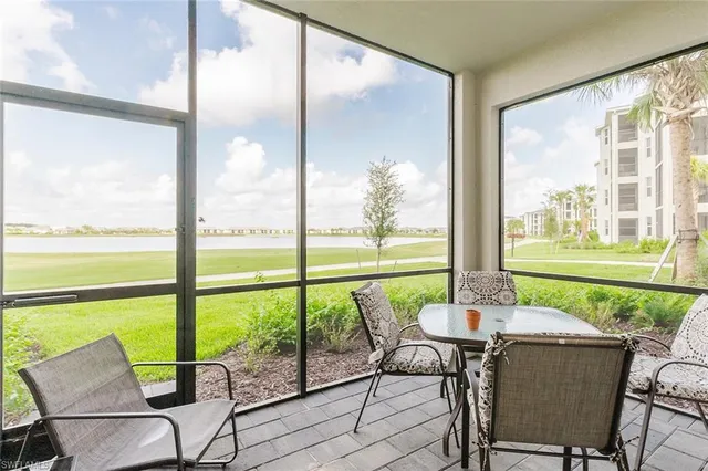 a view of a city from a dining room with large windows and outside view
