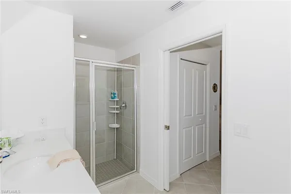 a bathroom with a shower and a sink
