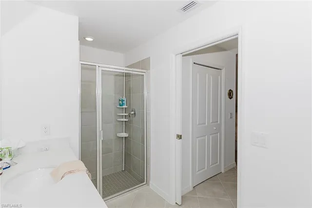 a bathroom with a shower and a sink